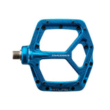 Blue Race Face Atlas mountain bike pedal with topographic design, featuring durable aluminum construction and multiple grip pins for trail riding.