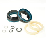 Bike suspension seal kit with black, blue, and cream rings for maintenance and repair