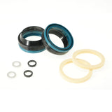 Bike suspension seal kit with black, blue, and beige rings for maintenance and repair