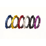 Cane Creek bicycle headset spacers in blue, yellow, red, silver, black, and purple colors