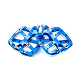 A pair of bright blue metal bicycle pedals with white geometric stripe patterns, displayed on a clean white background.