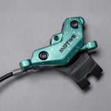 Teal SRAM brake lever with white speckles, designed for mountain bikes