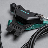 SRAM bike brake caliper with teal accents, precision mountain bike component