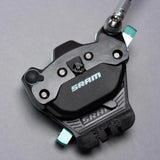 SRAM bike brake caliper with teal accents for mountain biking performance