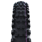 Black mountain bike tire with purple stripe, rugged tread design for off-road performance