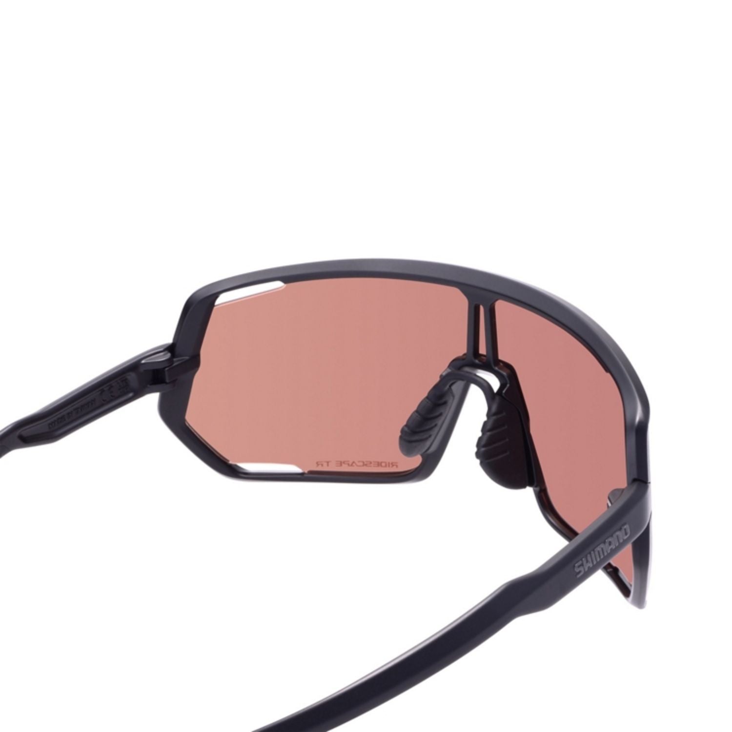 Close-up of Shimano cycling sunglasses with rose-tinted lenses and black frames