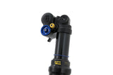 Black bike suspension fork with blue and gold adjustment knobs, featuring TTX branding